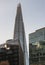 The Shard Tower in London with surrounding corporate buildings with sky background