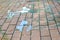 Shards of broken glass. Pieces of broken glass on the paving stones. The concept of destruction