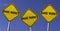 Share Market - three yellow signs with blue sky background