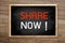 Share now concept on chalkboard and background with Brown wood p