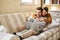 They share a strong connection. a young couple using a laptop while relaxing at home.