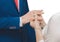 Sharing wedding rings at wedding close-up, on a white background, isolated