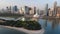 Sharjah aerial view above Al Noor island and mosque and downtown rising above Khalid lake