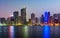 Sharjah waterfront cityscape in UAE at blue hour