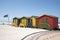 Shark lookout post flag and beach huts South Africa