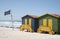 Shark lookout post flag and beach huts South Africa