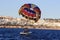 Sharm El Sheikh, Egypt - February 3 2018: Tourists are extremely entertained flying parasailing