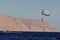 Sharm El Sheikh, Egypt - February 3 2018: Tourists are extremely entertained flying parasailing