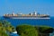 Sharm el-Sheikh, Egypt - March 14, 2018. A huge cargo ship carries containers with cargo in the Red Sea against the blue sky