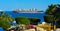 Sharm el-Sheikh, Egypt - March 14, 2018. A huge cargo ship carries containers with cargo in the Red Sea against the blue sky