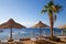 SHARM EL SHEIKH, EGYPT - March 18, 2019: Red Sea Coast, Concord Hotel. Beach with umbrellas, sun beds and palm trees. Background