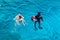 Sharm El Sheikh, Egypt May 08, 2019: Scuba divers dive into the clear blue water in the sea