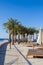 Sharm El Sheikh resort with palm trees and relaxing benches under the clean blue sky, dream wallpaper