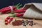 Sharp Chile pepper on a wood background, close-up