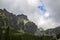 Sharp green grassy rocky mountain peaks of the High Tatra mountains during a cloudy day