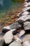 Sharp rocks on the shore of a mountain lake