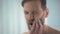 Sharp toothache disturbing man, dental caries, gingivitis, blurred effect