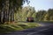 A sharp turn, a beautiful country road with a truck far