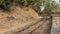 Sharp turns on narrow gauge rail network. Railway track laid down in the dense forest of India.