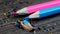 Sharpened blue and pink pencils and wood shavings