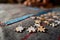 Shattered colorful jigsaw puzzle pieces kept in front against out of focus hand of a girl playing with them by completing an image