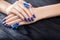 Shattered glass blue manicure on black background