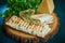 Shaurma cheese roll in a pita with with cheese and herbs on wooden background