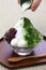 Shaved ice with matcha green tea syrup and azuki red beans jam