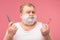 Shaving concept. Irritated puzzled man going to shave beard, holds sharp razor