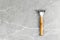 Shaving Razor with wooden handle on a grey marble