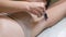 Shaving woman\'s underarm before laser hair removal