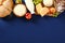 Shavuot dairy food, grape, apples and cereal breads on blue background. Flat lay, top view