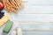 Shavuot jewish holiday celebration. Milk and cheese, ripe wheat and fruits, blue wooden background. Dairy products over blue