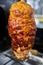 shawarma, lamb on a spit. street food. Doner Kebab on a rotating spit. A street food of Turkey.