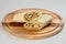 shawarma roll served on wooden plate, isolated on background.