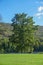 Shawnee on Delaware, Pennsylvania: An old couple sitting on a bench under a tree on the banks of the Delaware River