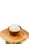 Shea butter in the wooden bowl stands on the wooden board, on th