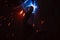 A sheaf of sparks caused by a welding arc. Semi-automatic welding work. Using a plasma torch.