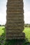 Sheaves of hay stacked into wall on the field in england uk on a sunny day