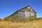 Shed in middle of a harvested wheat field