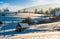 Shed on snow covered agricultural hillside