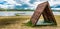 A shed standing on the beach by the lake