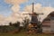 Shed and windmills in Dutch fairytale village Giethoorn, painting by Willem Tholen
