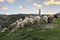 Sheep and goats in the pasture on the background of the mosque in the village of Verkhniy Karanay