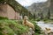 A sheep grazes near the Tarma river, in the city of Palca.