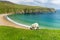 Sheep grazing near Silver Strand, a sandy beach in a sheltered, horseshoe-shaped bay, situated at Malin Beg, near Glencolmcille,