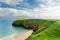 Sheep grazing near Silver Strand, a sandy beach in a sheltered, horseshoe-shaped bay, situated at Malin Beg, near Glencolmcille,