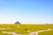 Sheep grazing on the salt meadows close to the Mont Saint-Michel tidal island in Normandy, France