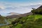 A sheep looking down towards the road at Mamore Gap, Clonmany, D