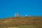 Sheep pasture against blue sky